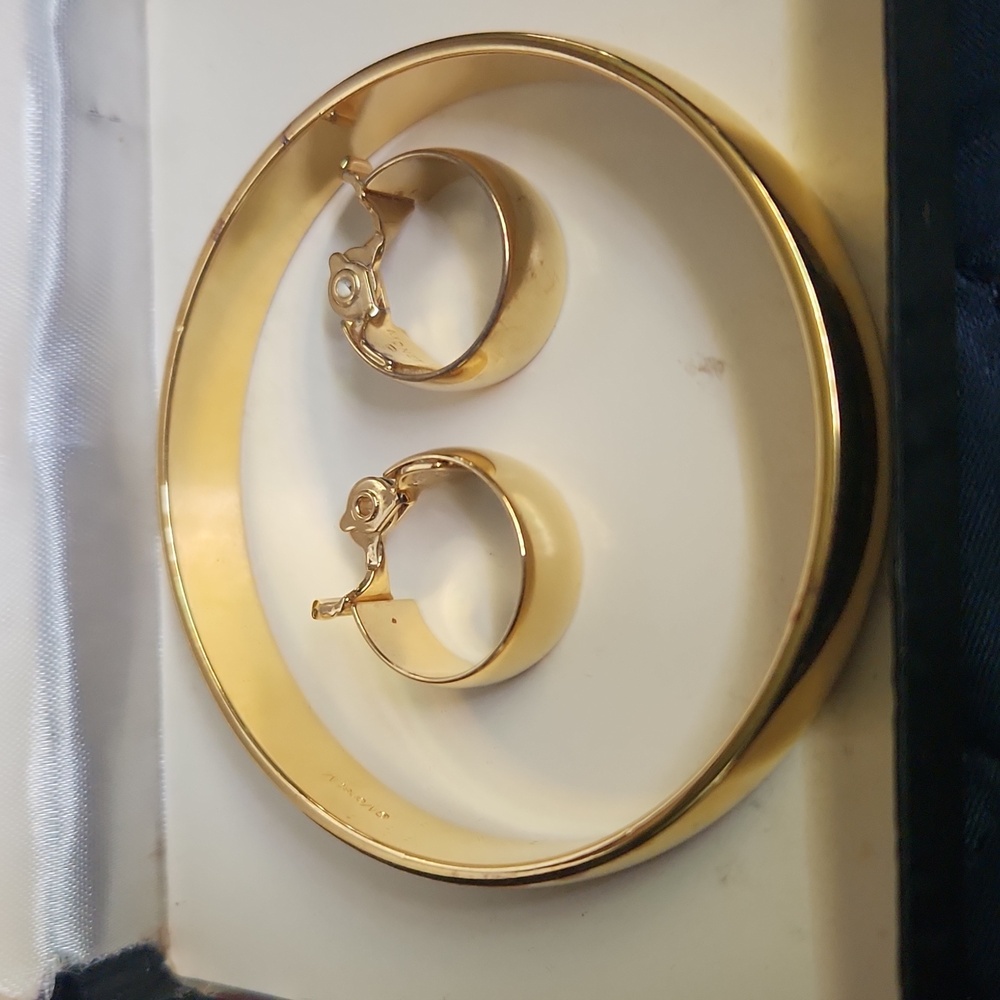 Vintage signed Monet gold toned bangle with matching gold toned clip on earrings